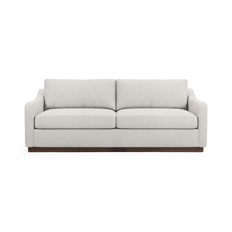 Classic Home Aspen stationary sofa with plush cushions and elegant design, shown in a cozy living room setting.