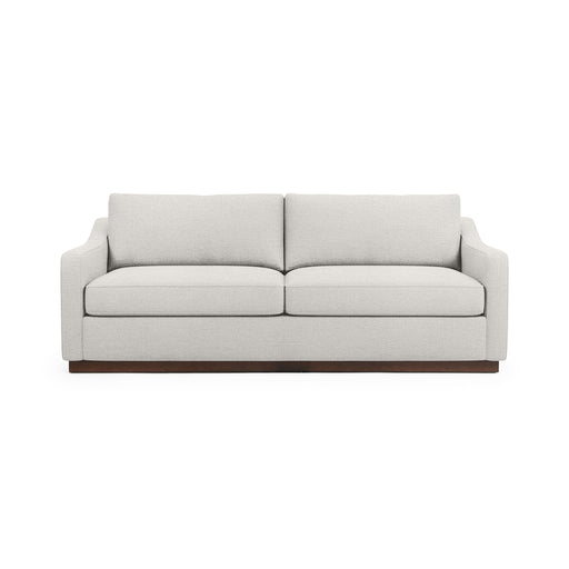 Classic Home Aspen stationary sofa with plush cushions and elegant design, shown in a cozy living room setting.