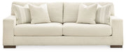 Signature Design by Ashley Maggie stationary living room set with a cozy chair and ottoman in neutral fabric.