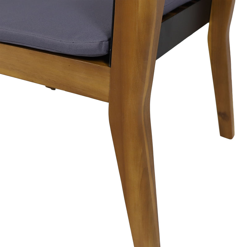 Set of two Noble House Soho outdoor club chairs with teak frames and cushions, perfect for transitional style outdoor seating.