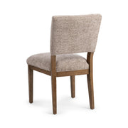 Pair of Classic Home Arima dining chairs in a set, featuring wooden legs and upholstered seats for a stylish dining room look.