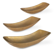 Set of three Uttermost Anas bowls in antique brass with elegant, rounded design for decorative or functional use.