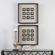 Black linen shadow box wall decor featuring a geode design by Uttermost, showcasing textured stone and artistic craftsmanship.
