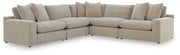 Benchcraft® Maxton Heights stationary sectional sofa with plush cushions and modern design, shown in a spacious living room setting.