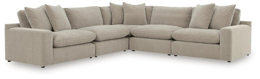 Benchcraft® Maxton Heights stationary sectional sofa with plush cushions and modern design, shown in a spacious living room setting.