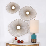Set of three gold metal wall art pieces by Uttermost, modern abstract wall decor with geometric shapes for stylish home decoration.