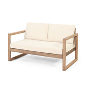 Four-piece Noble House acacia wood outdoor furniture set with beige cushions, includes patio chairs and coffee table for backyard or porch.