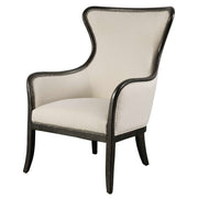 Uttermost Sandy wing back armchair in beige and dark brown fabric, with plush cushioning and elegant design.