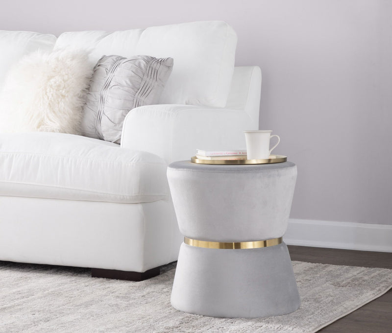 Lumi Source Gemma silver and gold contemporary glam ottoman with a sleek, rounded design and plush upholstery.