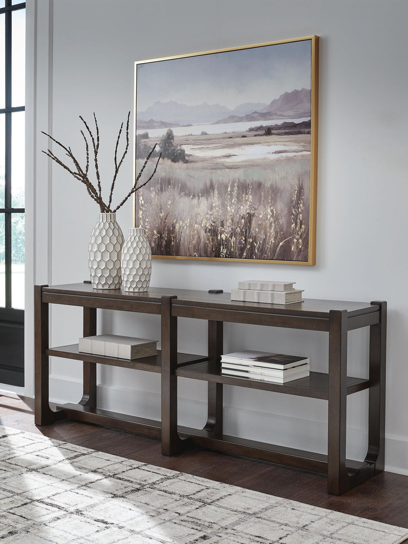 Dark brown Breckington sofa table by Signature Design by Ashley® with a sleek rectangular surface and sturdy legs.