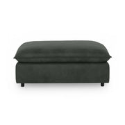 Classic Home Caplan upholstered ottoman with soft fabric and sturdy wooden legs, ideal for living room or lounge seating.