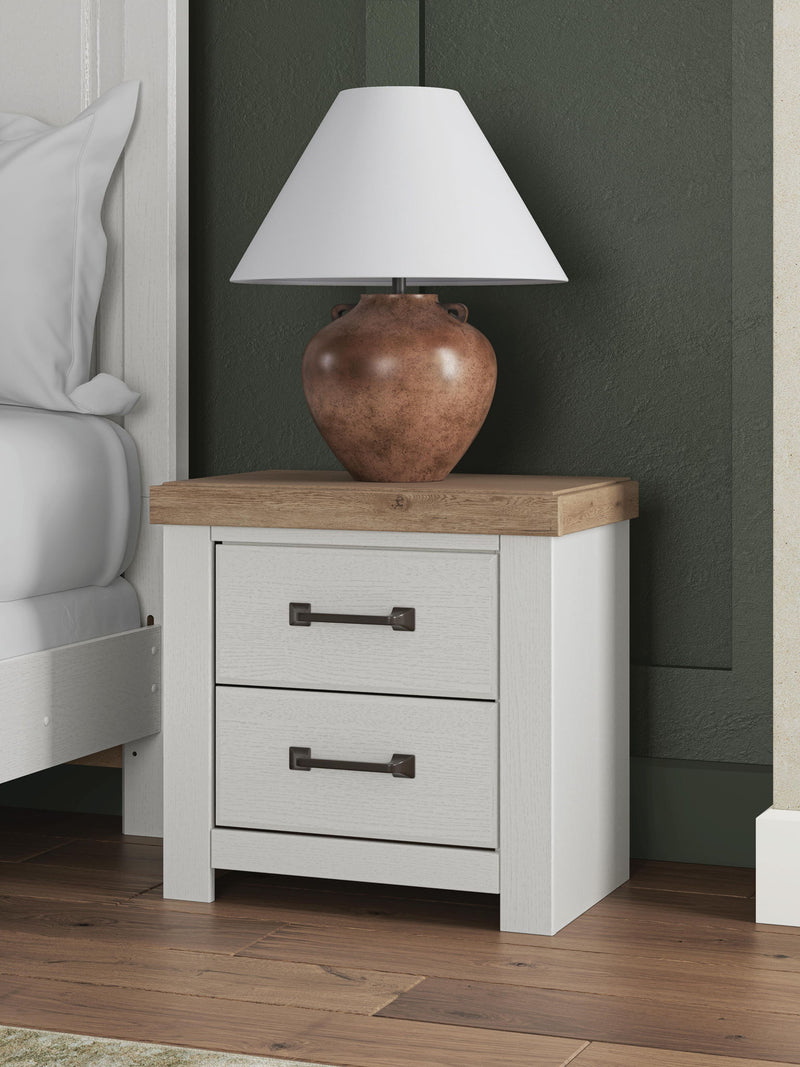 White and brown Benchcraft Savonport two-drawer night stand with charging station and modern design.