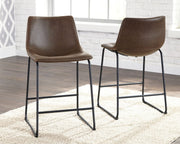 Set of two Signature Design by Ashley® Centiar upholstered barstools with padded seats and backrests in a modern design.