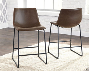 Set of two Signature Design by Ashley® Centiar upholstered barstools with padded seats and backrests in a modern design.
