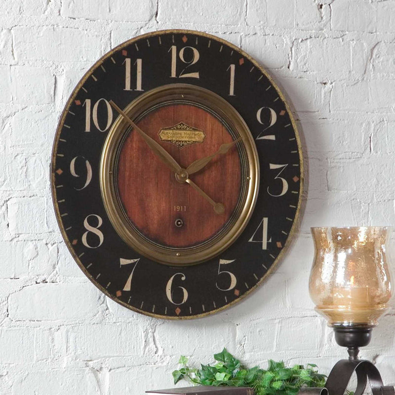 Uttermost Alexandre Martinot 23-inch black wall clock with a modern round design and minimalist black clock face.