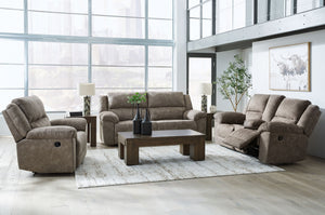 Signature Design by Ashley Laresview reclining sofa and loveseat set in a modern living room setup with plush upholstery and comfortable design.