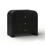 TOV Furniture Hump bedside chest with two drawers and sleek modern design, placed next to a bed in a contemporary bedroom setting.
