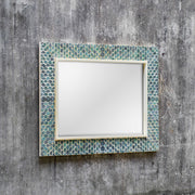 Uttermost Makaria Coastal Wall Mirror in Blue with a contemporary design and round shape, ideal for coastal or modern decor.