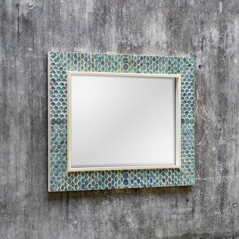 Uttermost Makaria Coastal Wall Mirror in Blue with a contemporary design and round shape, ideal for coastal or modern decor.
