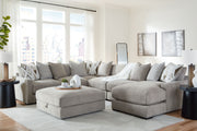 Benchcraft® Aslan Court 5-piece sectional with ottoman set in neutral fabric, showing plush cushions and modern living room style.