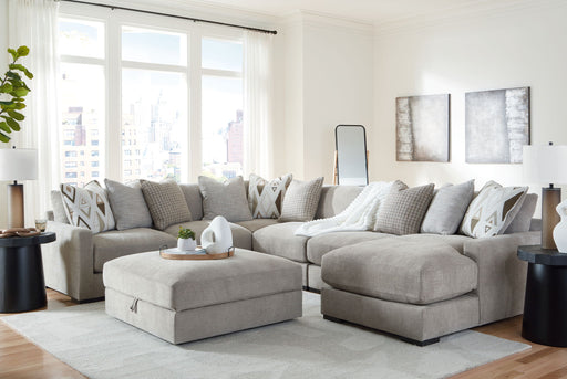 Benchcraft® Aslan Court 5-piece sectional with ottoman set in neutral fabric, showing plush cushions and modern living room style.