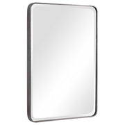 Uttermost Aramis silver wall mirror with a sleek, modern rectangular frame hanging on a wall.