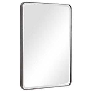 Uttermost Aramis silver wall mirror with a sleek, modern rectangular frame hanging on a wall.
