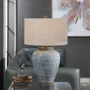 Uttermost Pelia table lamp in light aqua with a sleek, modern design and a textured base, perfect for living room or bedside.