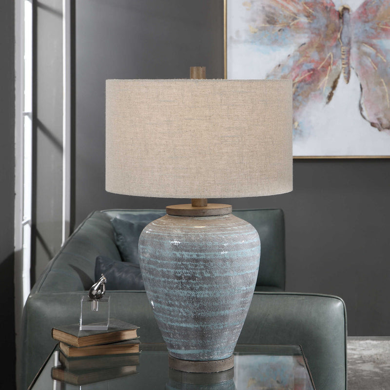 Uttermost Pelia table lamp in light aqua with a sleek, modern design and a textured base, perfect for living room or bedside.