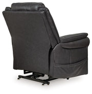Signature Design by Ashley Oatman Power Lift Recliner in plush fabric, showing the reclined chair with armrests and control panel.