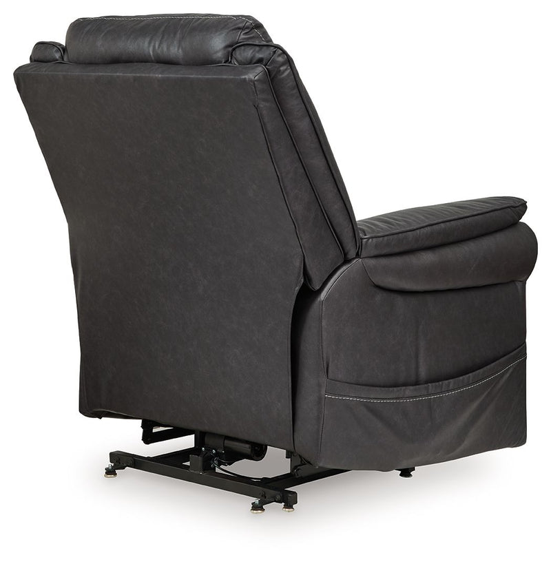 Signature Design by Ashley Oatman Power Lift Recliner in plush fabric, showing the reclined chair with armrests and control panel.