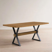 Brown farmhouse-style dining table with X-shaped legs and moulded details from Noble House, showcasing a sturdy, rustic wood design.