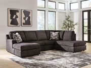 Signature Design by Ashley Lentiz stationary sectional sofa with plush cushions and modern design, shown in a stylish living room setting.