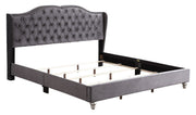 Transitional upholstered bed by Glory Furniture with padded headboard and wooden frame, shown in a modern bedroom setting.