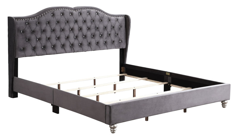 Transitional upholstered bed by Glory Furniture with padded headboard and wooden frame, shown in a modern bedroom setting.