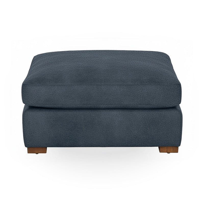 Classic Home Audrey upholstered ottoman with cushioned top and wooden legs, ideal as a versatile living room accent piece.