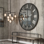 Large bronze wall clock from Uttermost's Amelie collection, featuring a stylish round design with antique-inspired details.