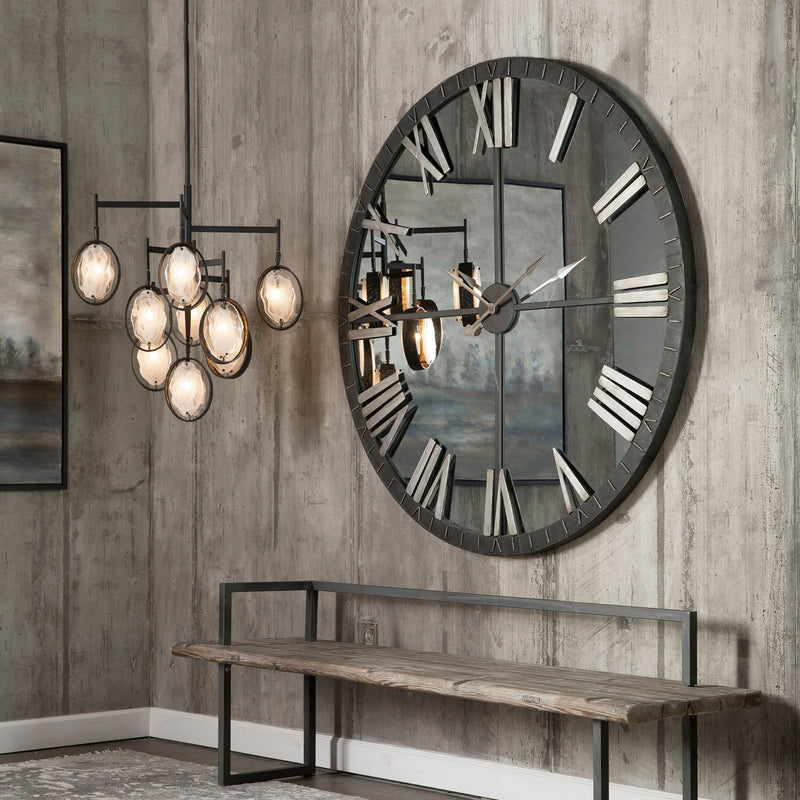 Large bronze wall clock from Uttermost's Amelie collection, featuring a stylish round design with antique-inspired details.
