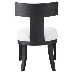 Uttermost Idris armless side chair with a modern design, featuring a sleek frame and comfortable upholstered seat.