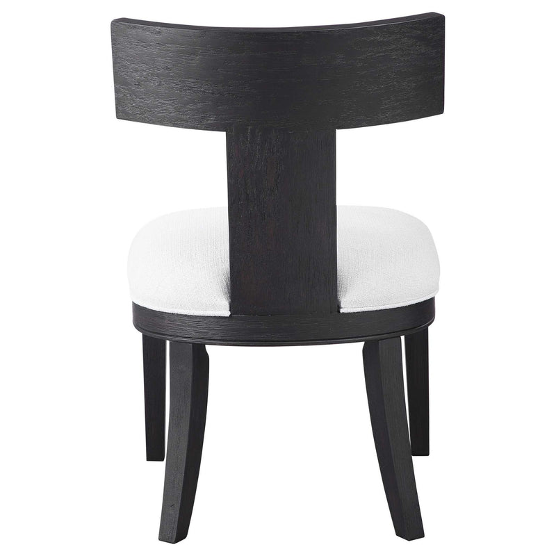 Uttermost Idris armless side chair with a modern design, featuring a sleek frame and comfortable upholstered seat.