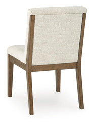 Set of two Benchcraft Marxmore dining upholstered side chairs in beige and brown with cushioned seats and wooden legs.