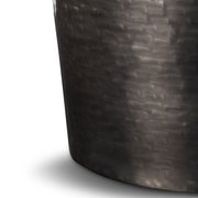 Simpli-Home Troy metal accent table with antique silver finish, showcasing a sleek round top and sturdy legs.
