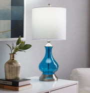 Lumi Source Jasmine contemporary table lamp with clear sapphire blue seeded glass shade, nickel finish, and white interior.