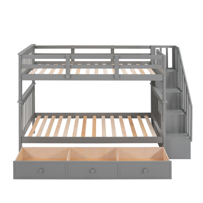 DreamHaus stairway bunk bed with built-in storage drawers and safety guard rail in a bedroom setting.