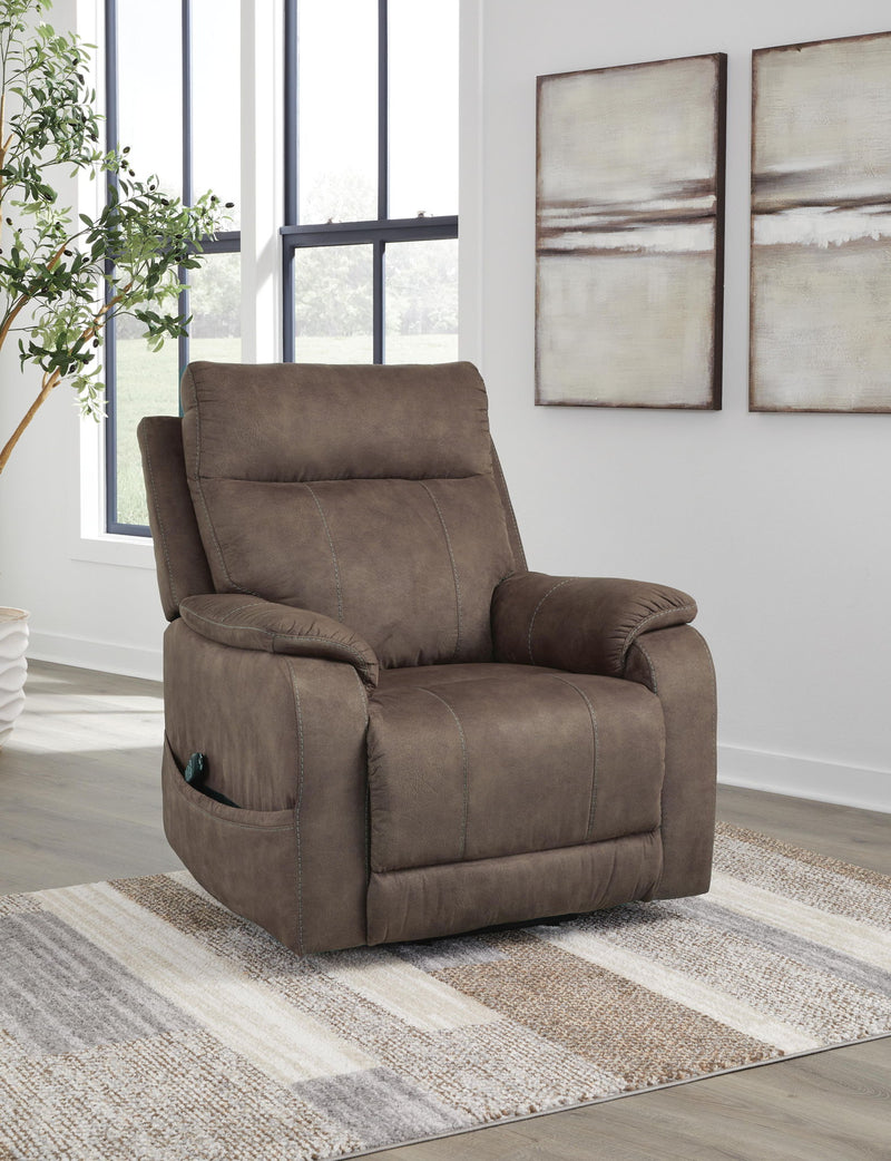 Signature Design by Ashley Crestmeade Power Lift Recliner with cushioned armrests and plush upholstery in a cozy living room setting.