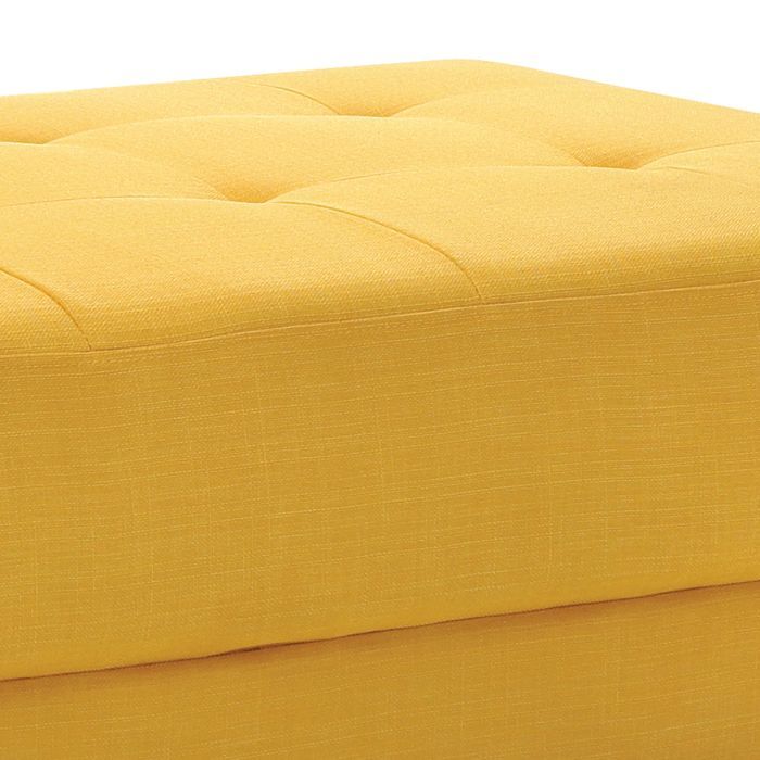Upholstered contemporary ottoman from Glory Furniture in a living room, featuring soft fabric and modern design.