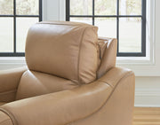 Ashley Mosswell power recliner with adjustable headrest in toffee, showcasing plush cushioning and relaxed reclining position.