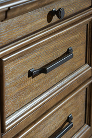 Signature Design by Ashley Karallin dresser with multiple drawers and a sleek wood finish, modern bedroom storage solution.