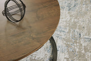 Set of three Signature Design by Ashley Cassbryn occasional tables in brown and black with modern, sleek tabletop designs.