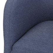 Uttermost Jacobsen accent chair with plush upholstery and wooden legs, featuring a modern design in a stylish living room setting.